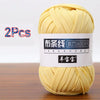 A ball of yellow soft chunky t-shirt yarn for crochet and knitting, packaged as a 2-pack.