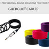 A collection of Guerguo audio cables in various colors and sizes, including coiled and straight XLR to 6.35mm connectors.
