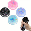 A set of four squishy stress relief toys in pink, blue, and black with confetti sprinkles.