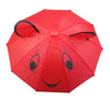 A bright red mini doll umbrella with bear face features and black trim.