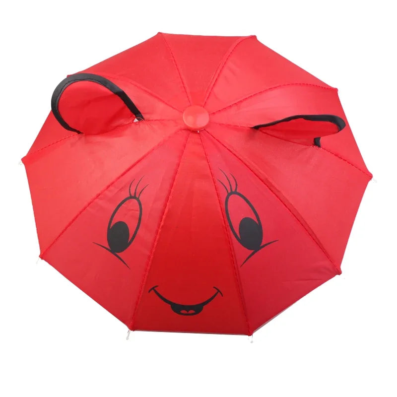 A bright red mini doll umbrella with bear face features and black trim.