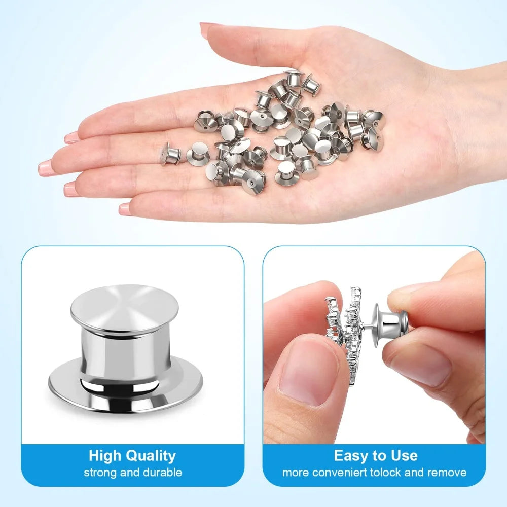 A hand holds numerous metal locking pins and backs for brooches, lapel pins, and badges, demonstrating their high quality and