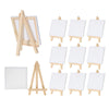 A set of mini wooden easels and white canvases for children's art projects.