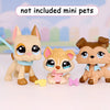 Three small animal figurines with collars and accessories are displayed on a white surface.
