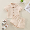 A beige linen shirt and matching shorts outfit set for a baby boy