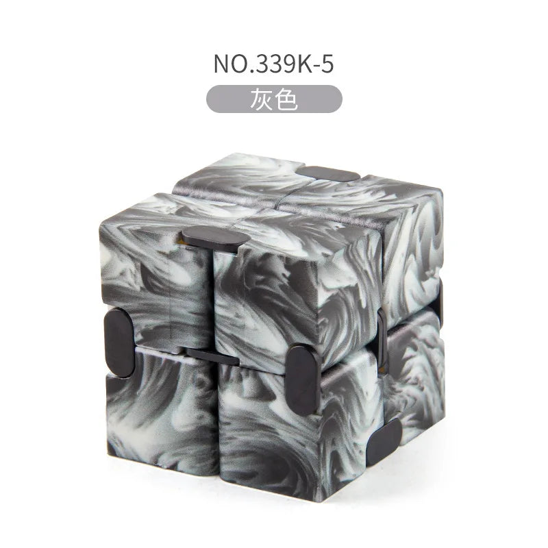 A stack of black and white marbled fidget cubes labeled NO.339K-5
