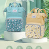 A light blue multi-function high-capacity mummy bag backpack displayed on a white stand with various features listed below.