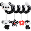 A set of black and white panda and cat sensory rattles hanging by strings.
