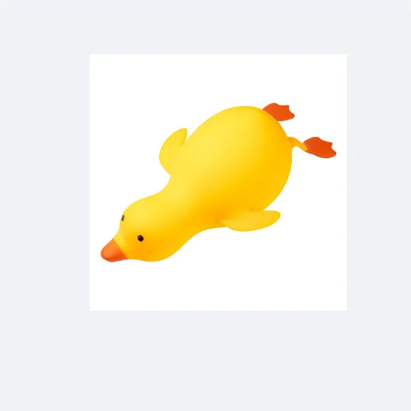 A bright yellow squishy duck fidget toy with orange feet.