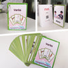 A stack of pink and green flashcards featuring action verbs like run and dance for children.