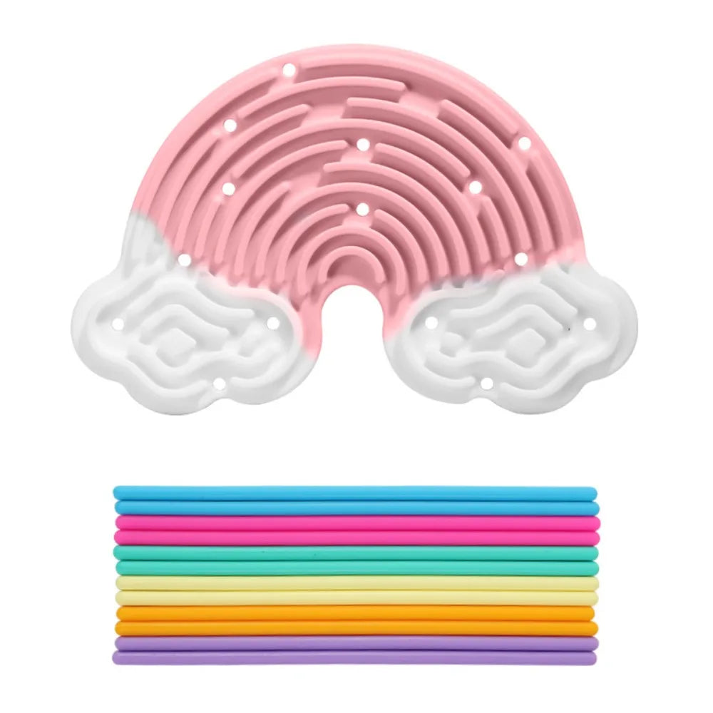 Pink and white silicone sensory activity board with 12 colorful strings stacked below