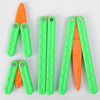 A set of three bright green and orange 3D printed butterfly knives or fidget toys.