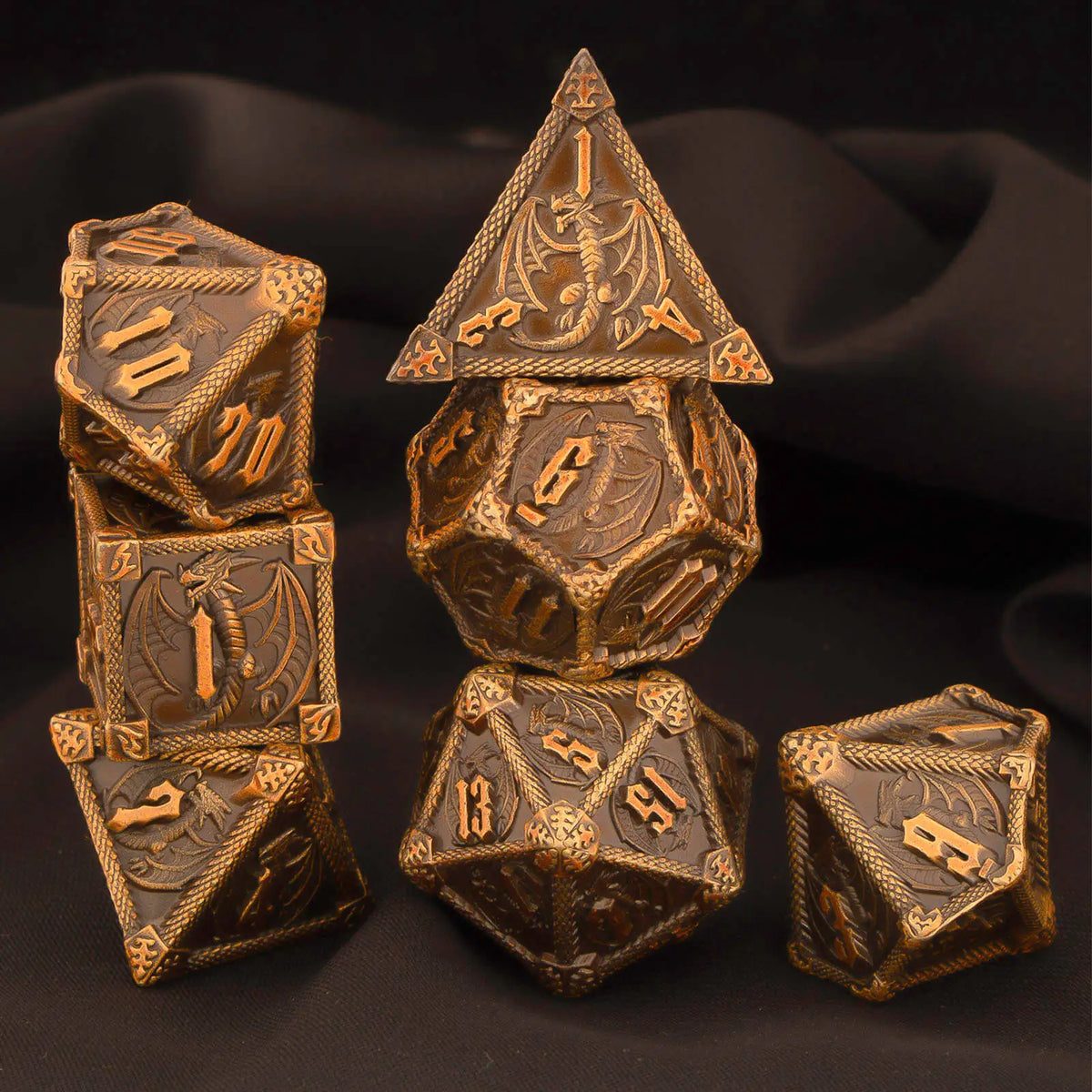 A set of seven premium metal polyhedral dice, including a d10 and d6, displayed on a dark surface.