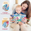 A woman is reading a dinosaur-themed soft cloth book to a baby, demonstrating the BiBi device and rattling paper features.