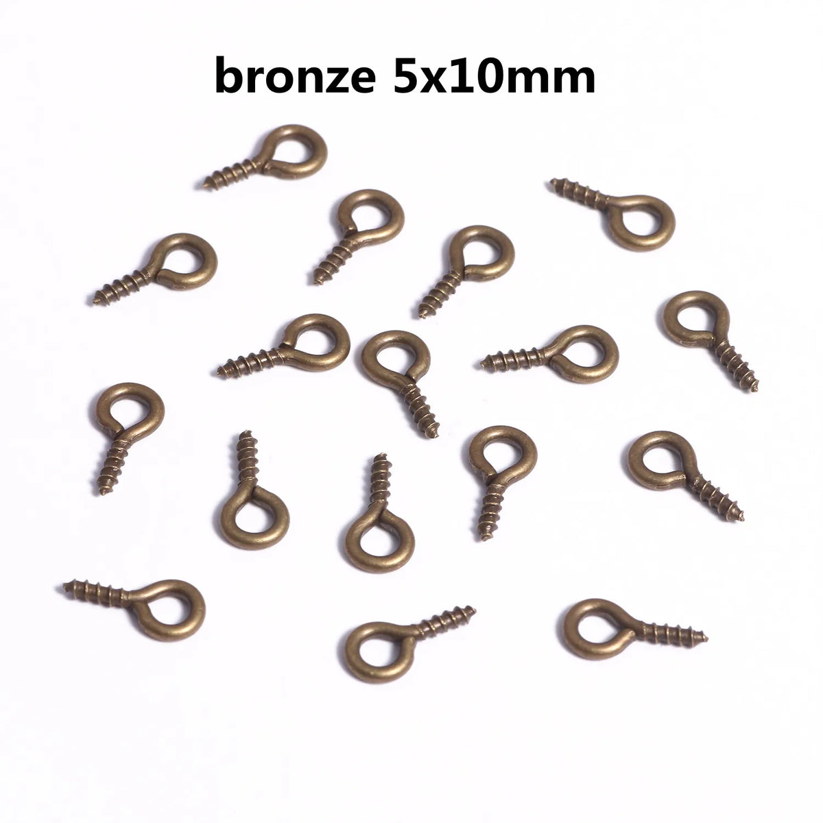 A collection of bronze 5x10mm eye pins with screw threads for jewelry making.