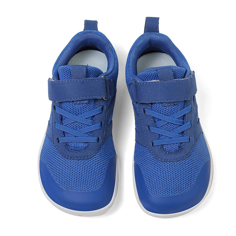 A pair of blue minimalist barefoot sneakers for kids, shown from the top view.
