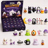 A dark purple Halloween advent calendar box filled with 24 spooky resin ornaments featuring ghosts and bats.