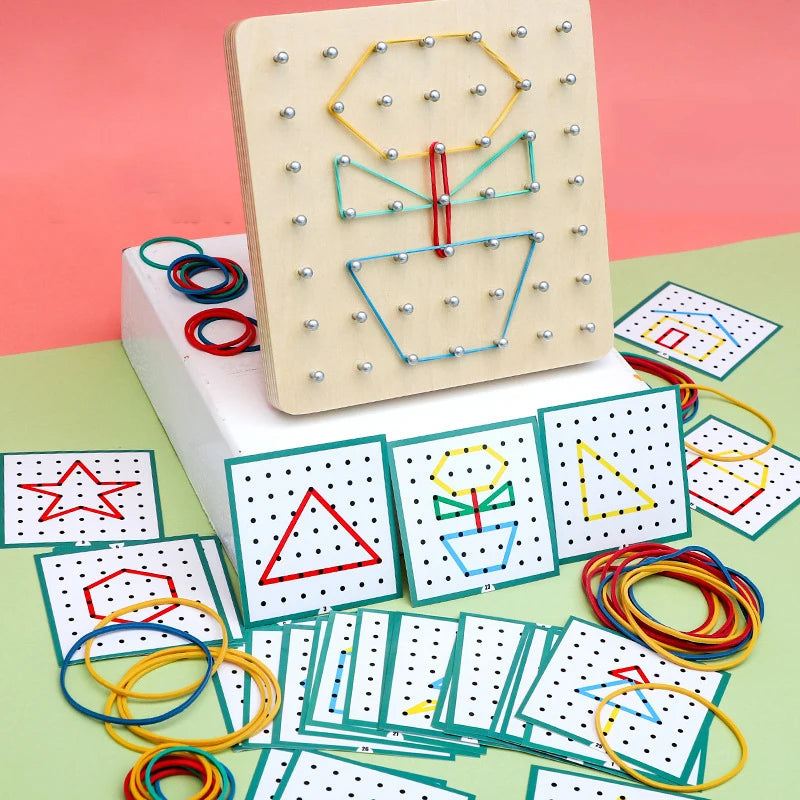 A wooden geometric shape peg board with pattern cards and various colored string shapes on a green surface.