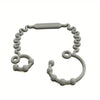 Pacifier anti-chute en silicone gris, en forme de anneau bouclé avec une texture sur le dessus.