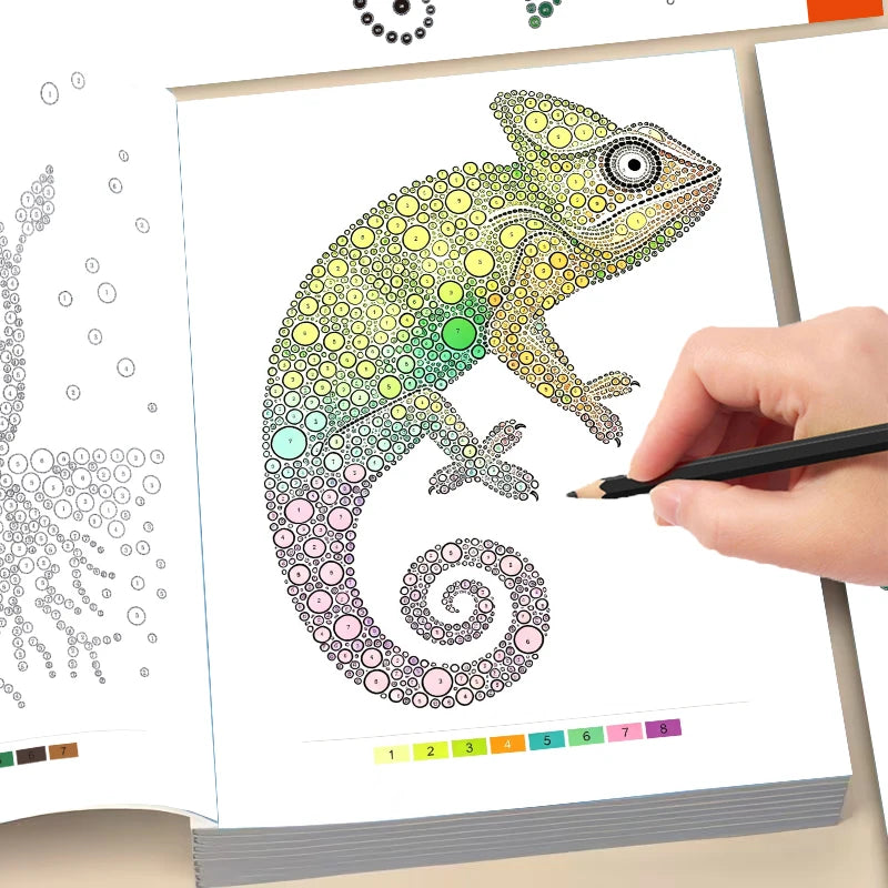 A hand holds a colored dot art drawing of a lizard, which is composed of tiny colored dots.