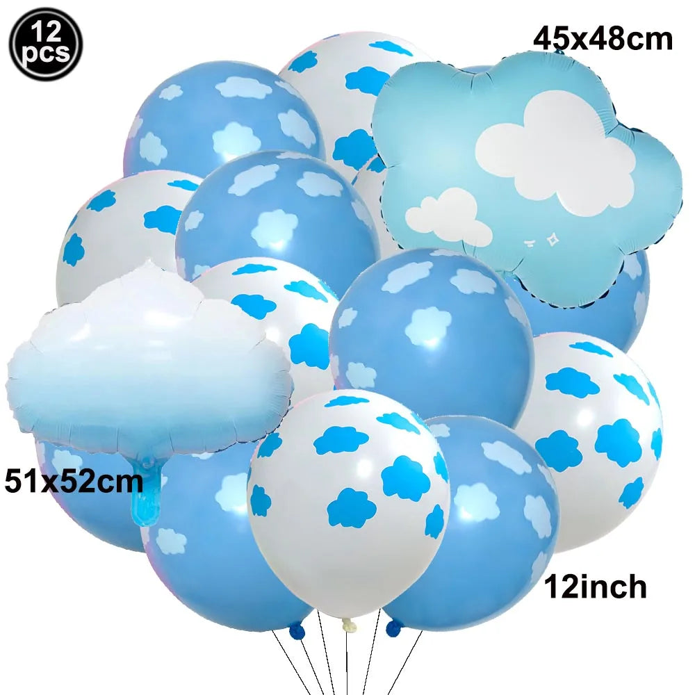 A collection of light blue and white foil balloons shaped like clouds and a plane for birthday party decor