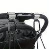 Close-up of heavy-duty stroller hooks attached to a black fabric bag or carrier.