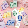 A collection of colorful cards for a couples conversation game featuring themes like talk, unfold, intimacy, and adventure.