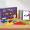 A box of Angram Kids Tangram puzzles with colorful wooden shapes laid out on a wooden table.