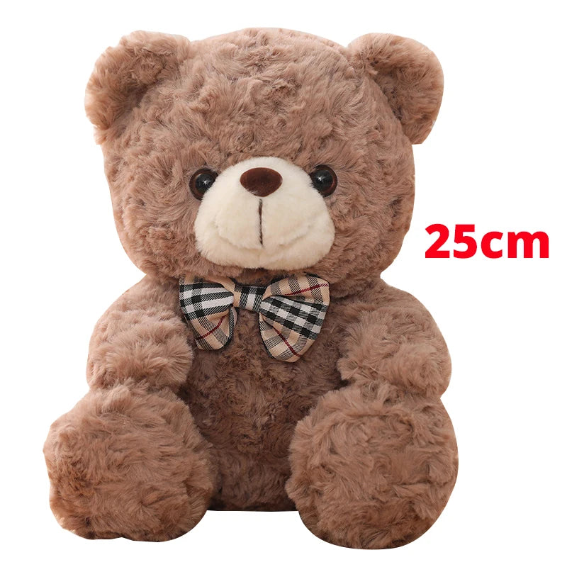 A brown teddy bear plush toy with a checkered bow, measuring 25cm.