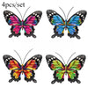 Set of four decorative iron butterfly wall art featuring vibrant colors like pink, blue, and orange.