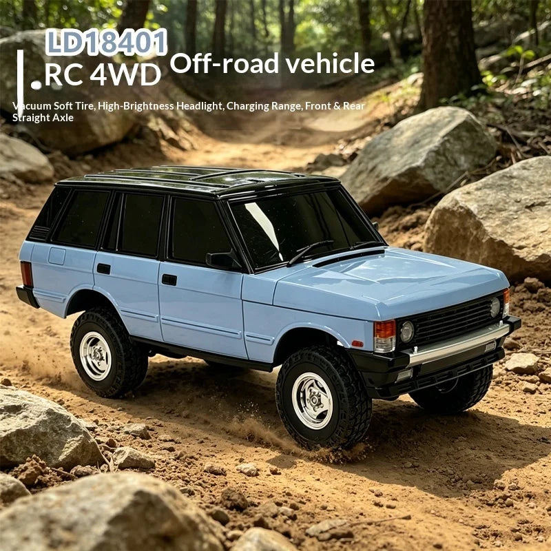 A light blue RC 4WD crawler truck is shown driving off-road over rocks and dirt.