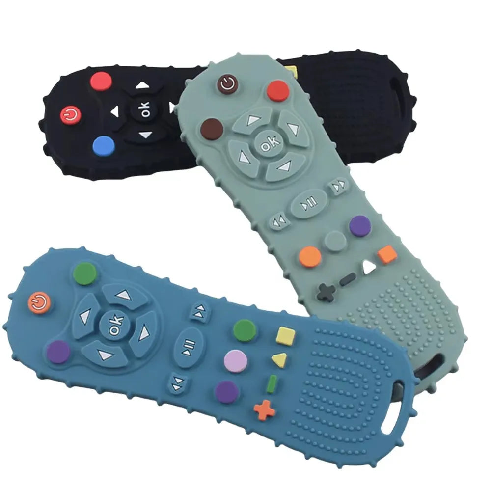 A set of silicone chew toys shaped like a remote control, featuring various buttons and controls in black, gray, and blue col