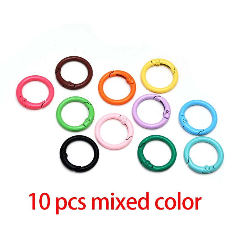 A collection of ten mixed color alloy snap hook keychain clips in various bright and dark shades.