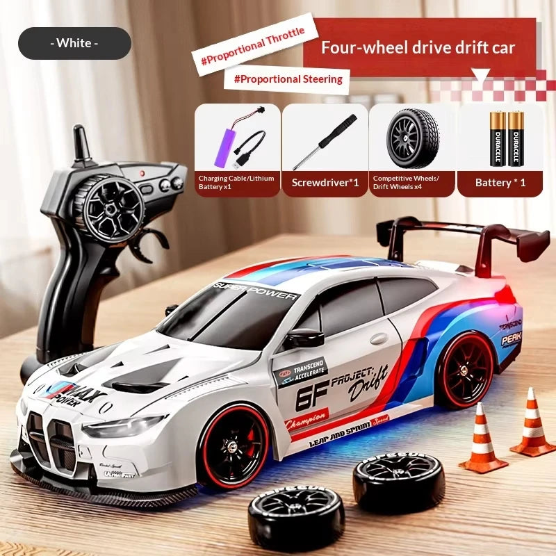 A white four-wheel drive drift car model is shown with various tools and accessories on a wooden surface.