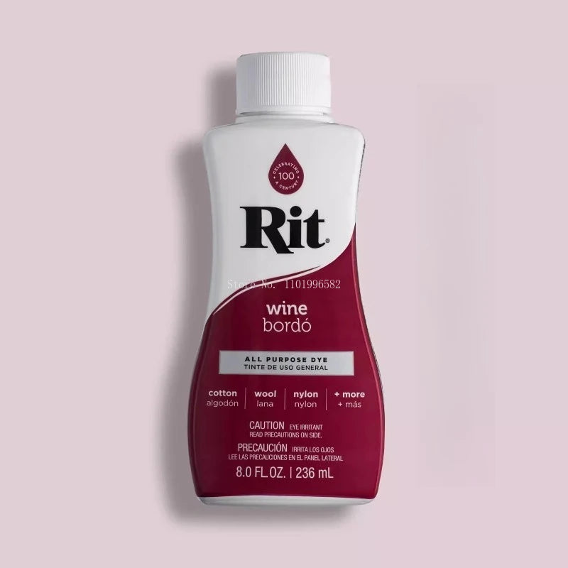 A white bottle of Rit All Purpose Dye with a red cap and label against a pink background.