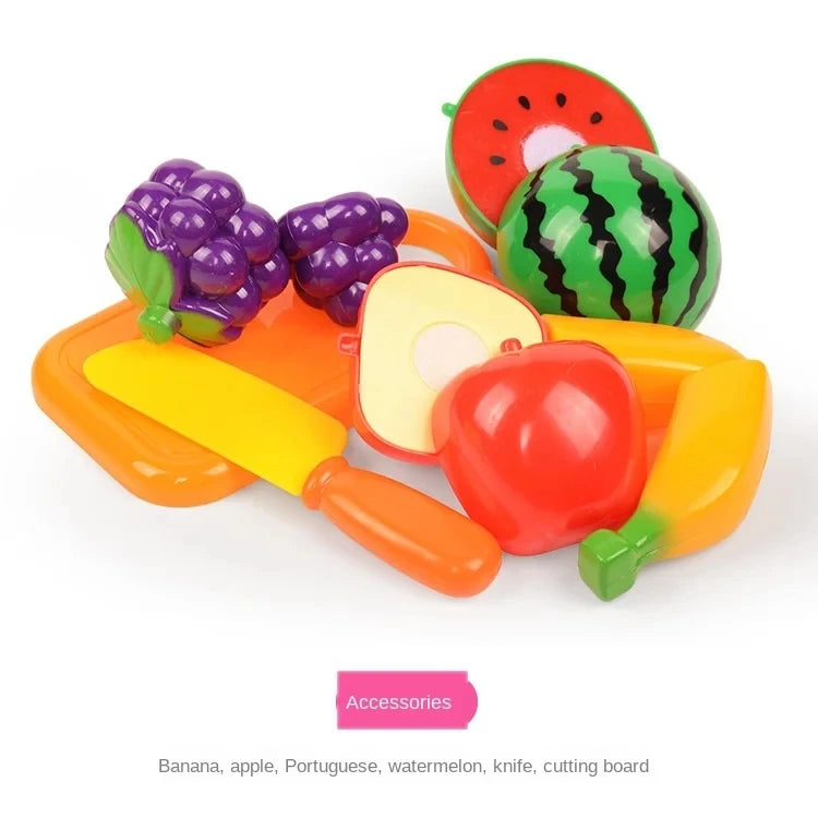 A pretend play cutting food toy set featuring fruits like banana, apple, and watermelon on a yellow cutting board.