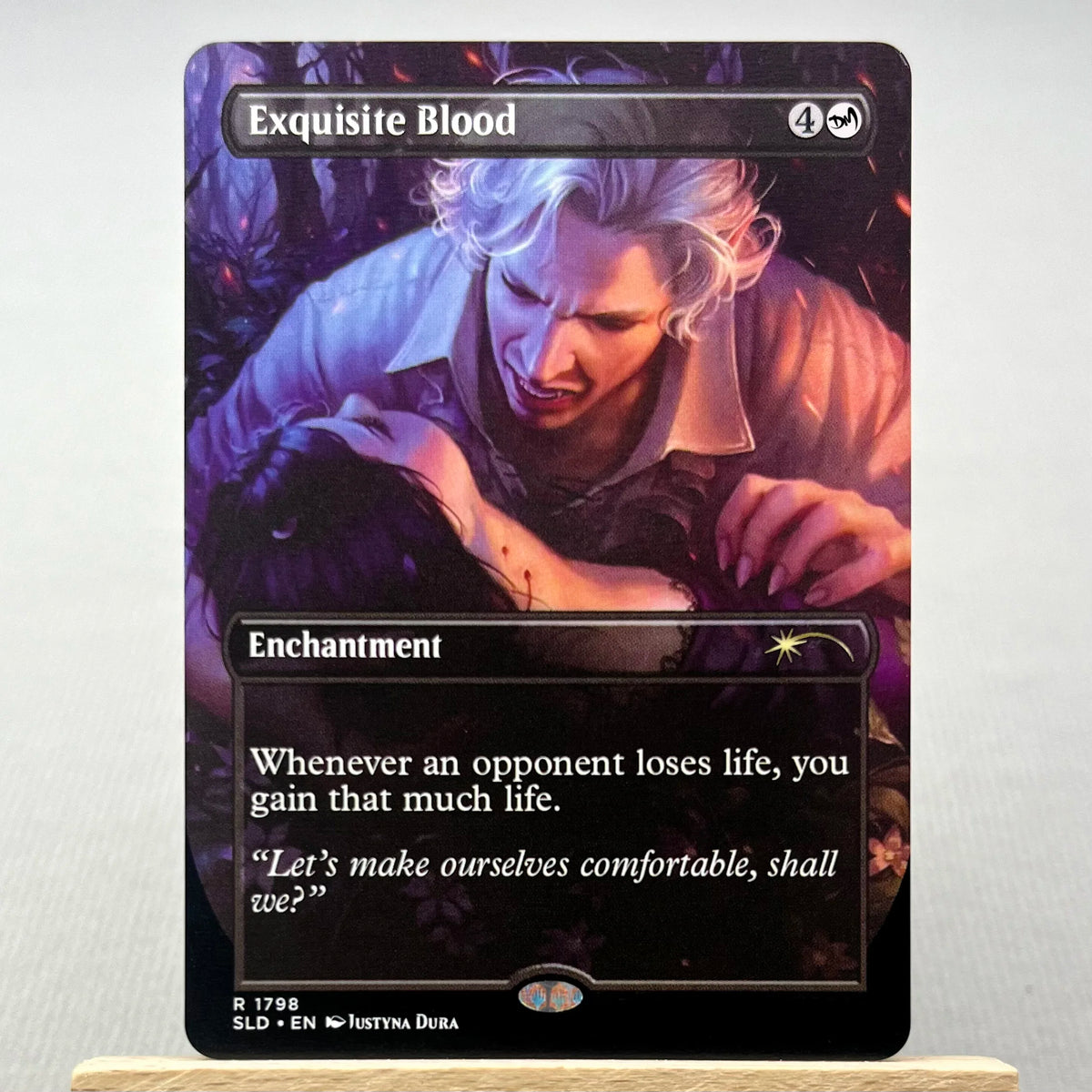 A Magic: The Gathering card named Exquisite Blood featuring a portrait of a pale-haired man.