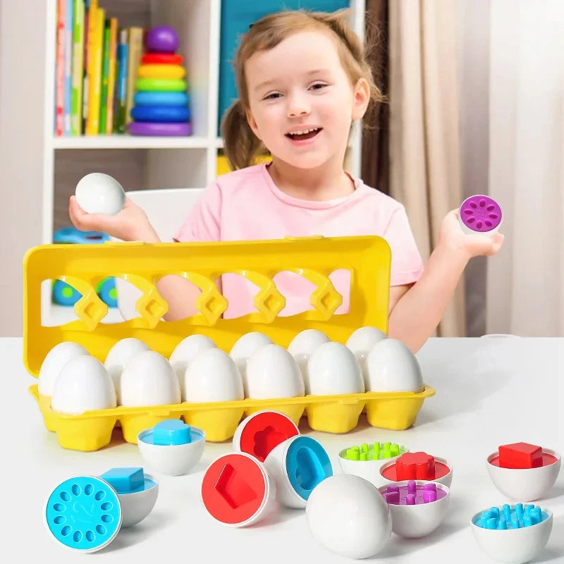 A young girl is holding a yellow plastic egg sorter filled with white eggs and various colored eggs for toddlers.