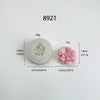 A white silicone mold shaped like a carnation flower, used for candle making and crafting.