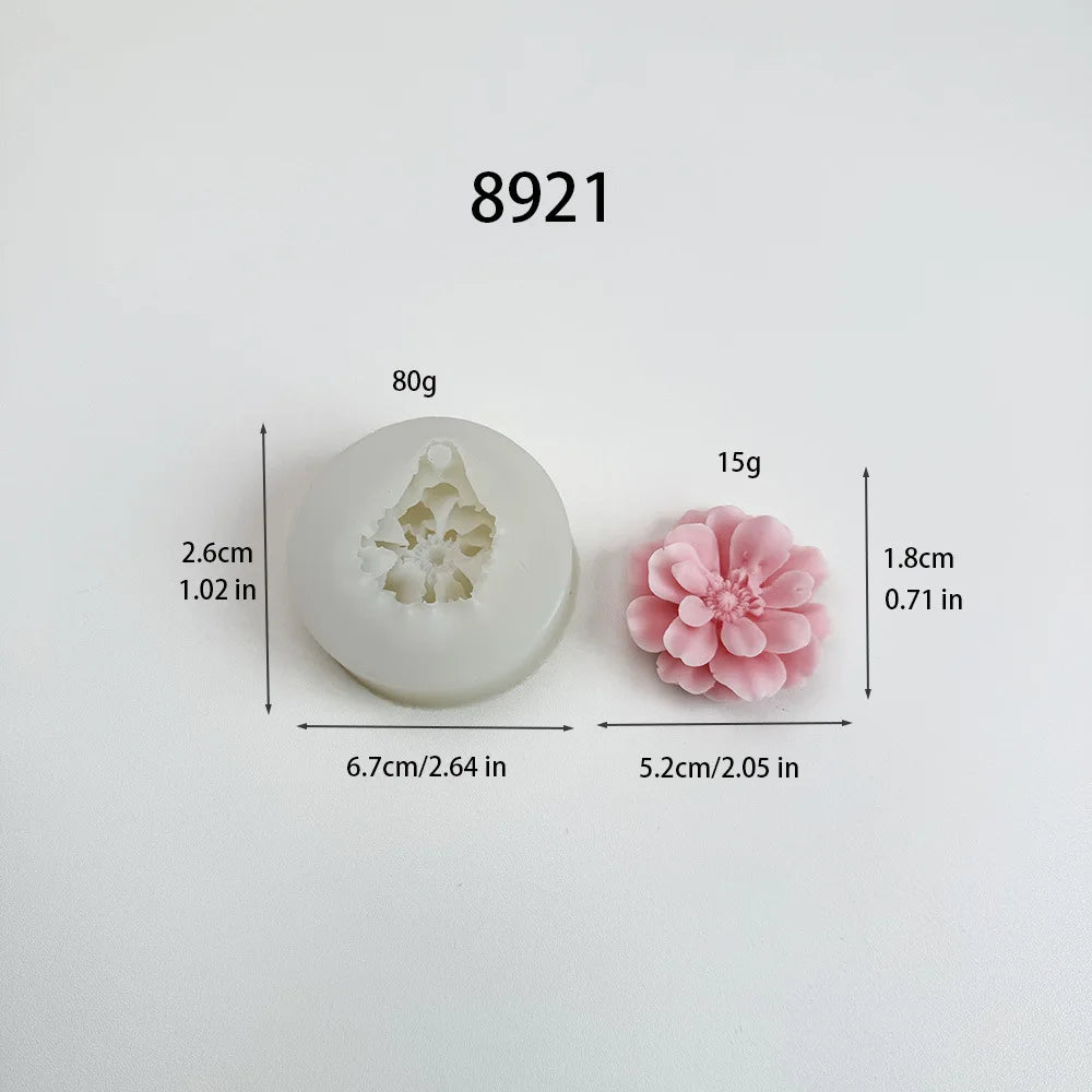 A white silicone mold shaped like a carnation flower, used for candle making and crafting.