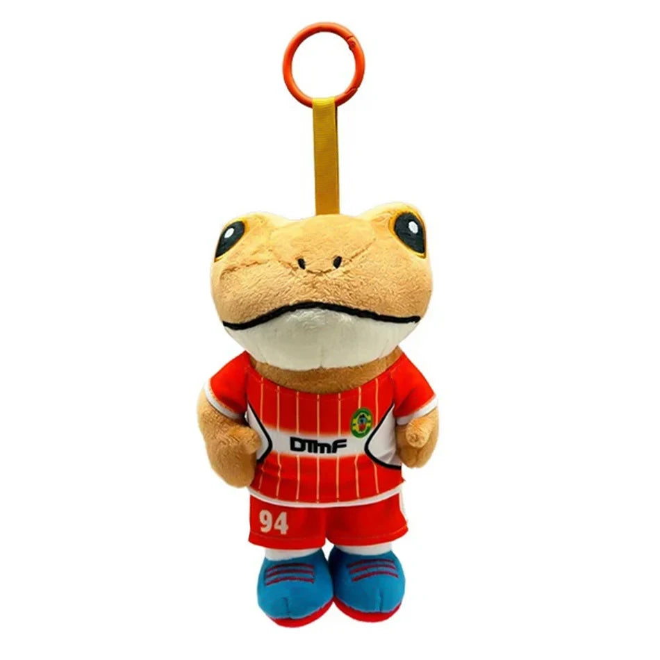 A plush toy of Bad Bunny El Sapo Concho with an orange hook and a red jersey.