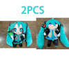 Two plush dolls of Hatsune Miku, one in teal and one in blue, collectible anime figures.