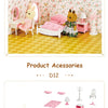 A pink themed bedroom set featuring a bed, vanity, and decorative furniture for a dollhouse.