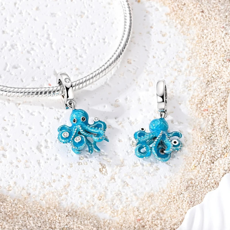 Sterling silver charm pendant set featuring starfish, sea turtle, and whale shark in blue enamel