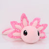 A pink kawaii axolotl plush toy with large eyes and ruffled features.