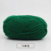 A ball of dark green pre-dyed milk cotton yarn for knitting and crochet.