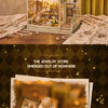 A detailed wooden miniature dollhouse kit featuring jewelry and decorative items displayed in a glass cabinet.