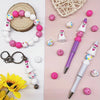 A set of 25 silicone beads in pink and white colors, including ghost shapes, for jewelry and crafting.