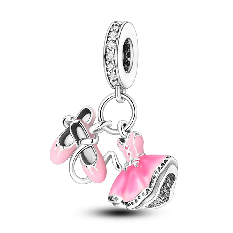 A silver heart charm bead with pink zircon stones and a bail for jewelry making.