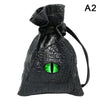 Black PU leather drawstring dice bag with an organizer compartment and a glowing green eye design